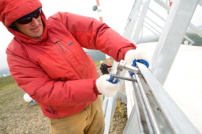 Scott Morley building a solar array for a communitcation site in Central Alaska